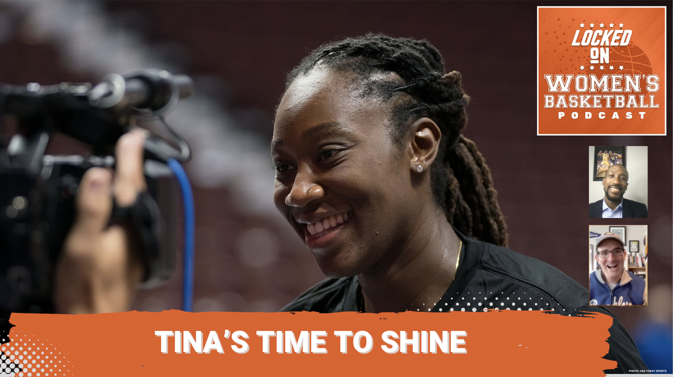 Tina Charles smiles on the court with a camera in her face.